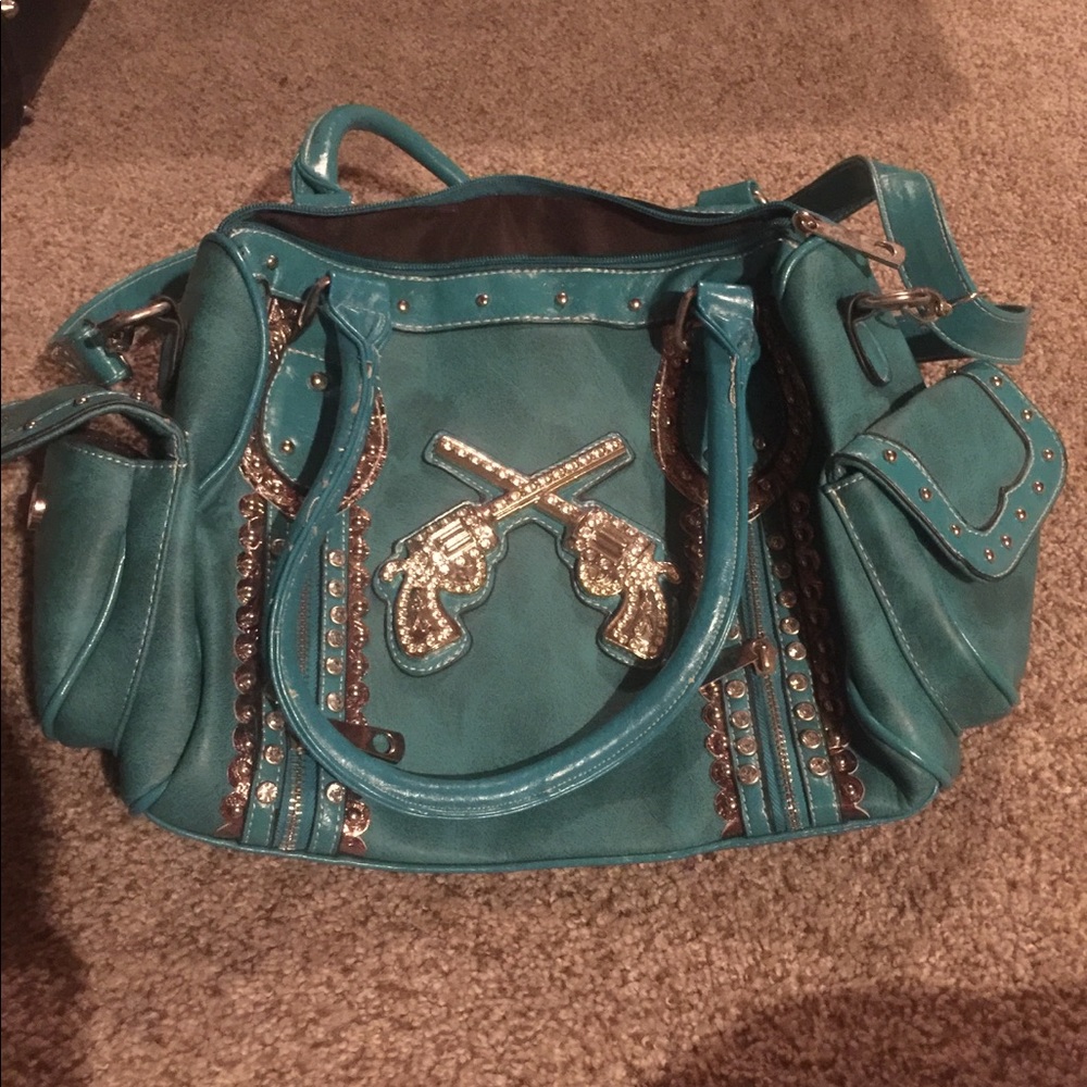 Purse with gun embellishments